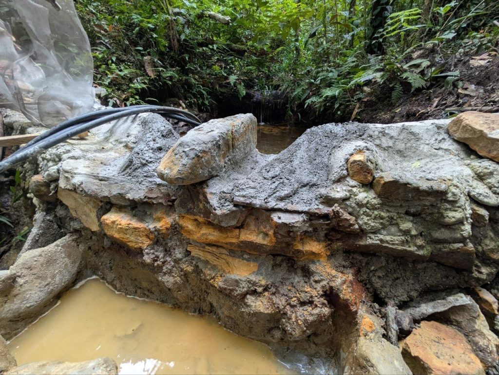 Photo of a rock-and-cement weir